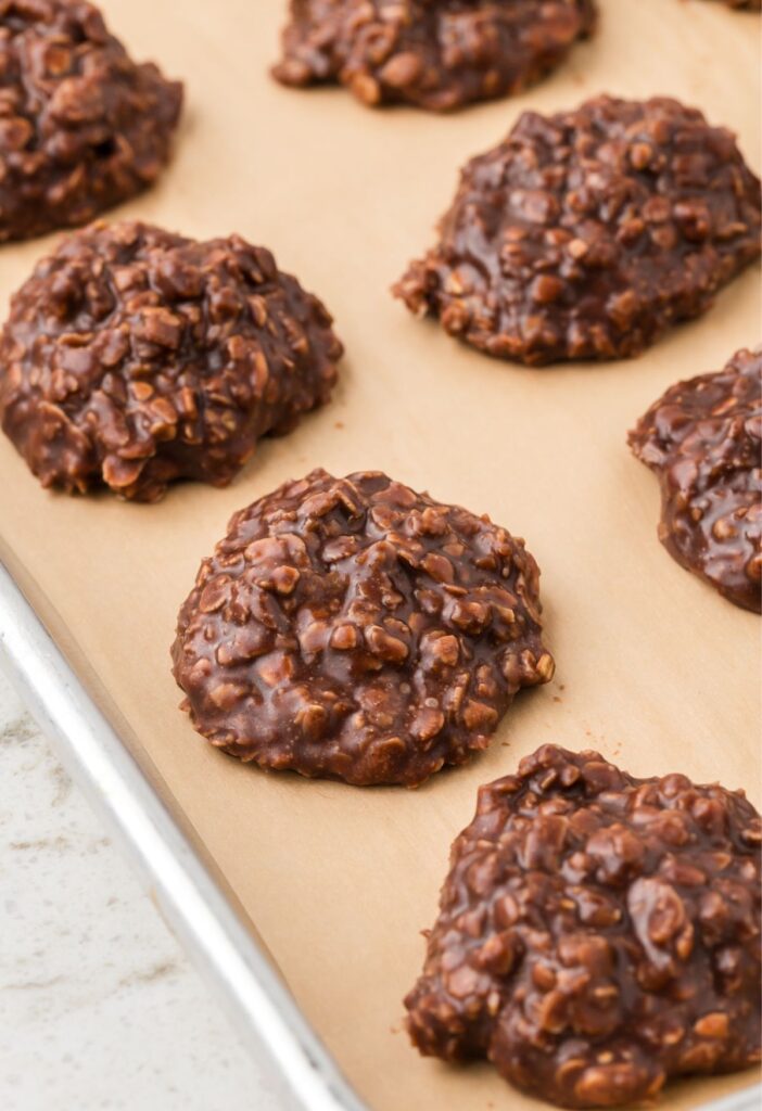 Tray of no bake cookies cooling on parchment paper