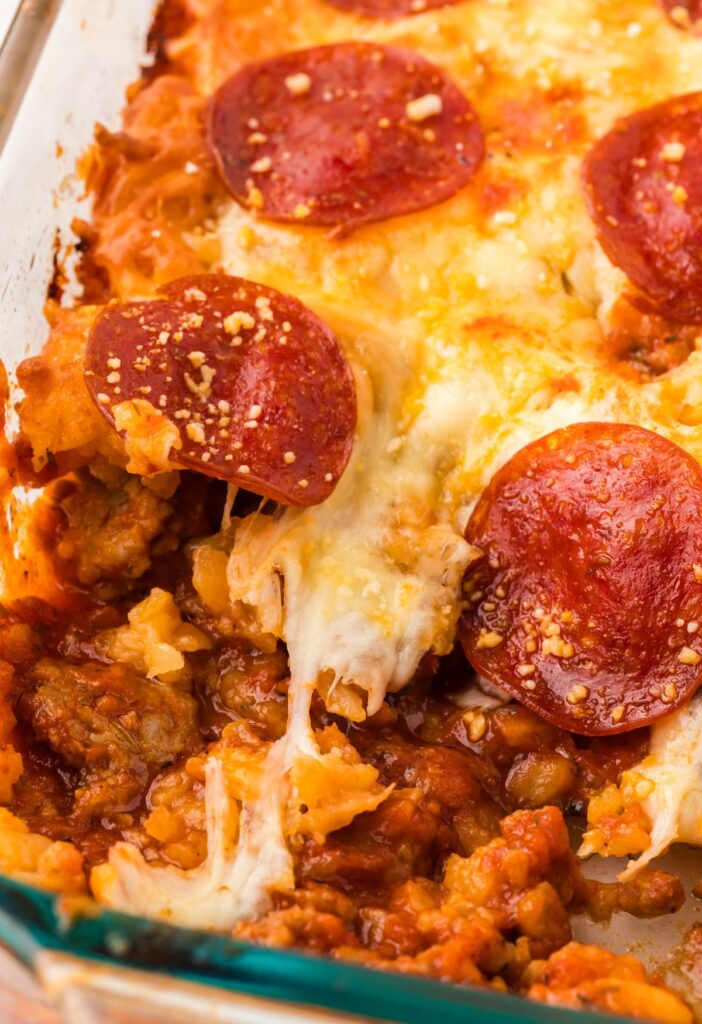 Close up of the gooey cheese and pizza sauce in the tater tot casserole.