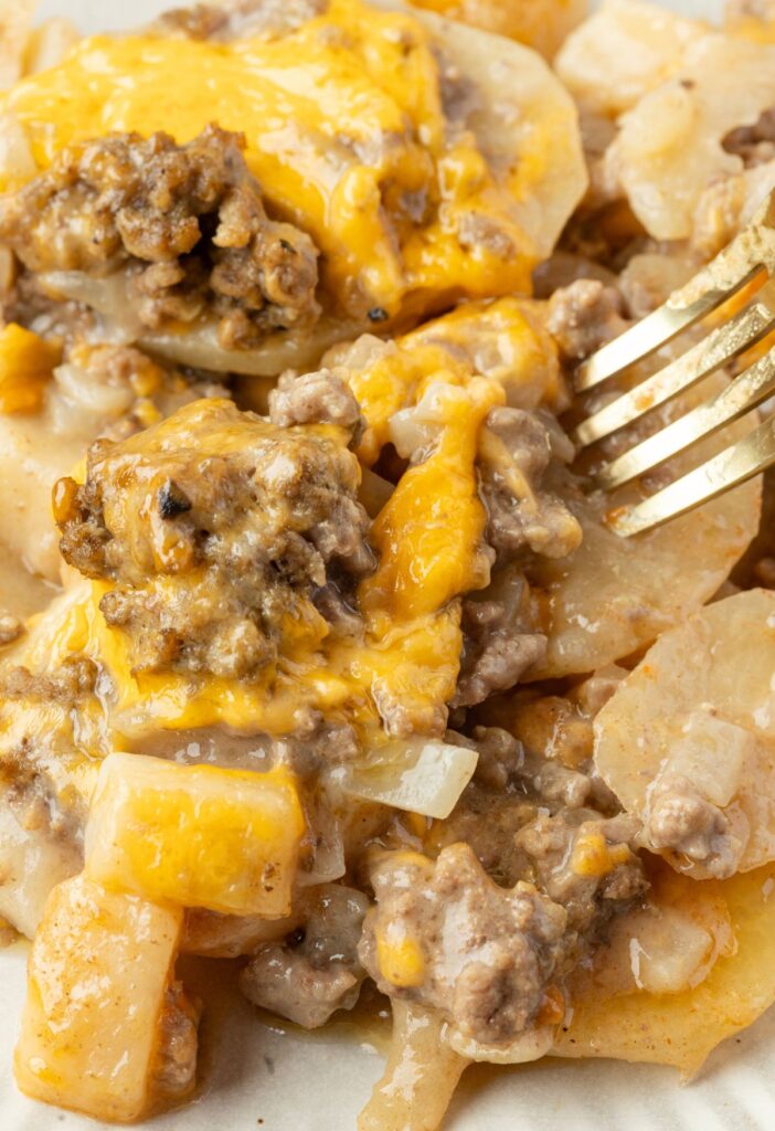 A serving of the casserole with a fork.