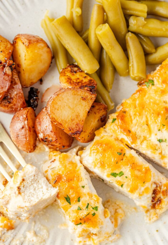 A plate of the chicken sliced with a fork
