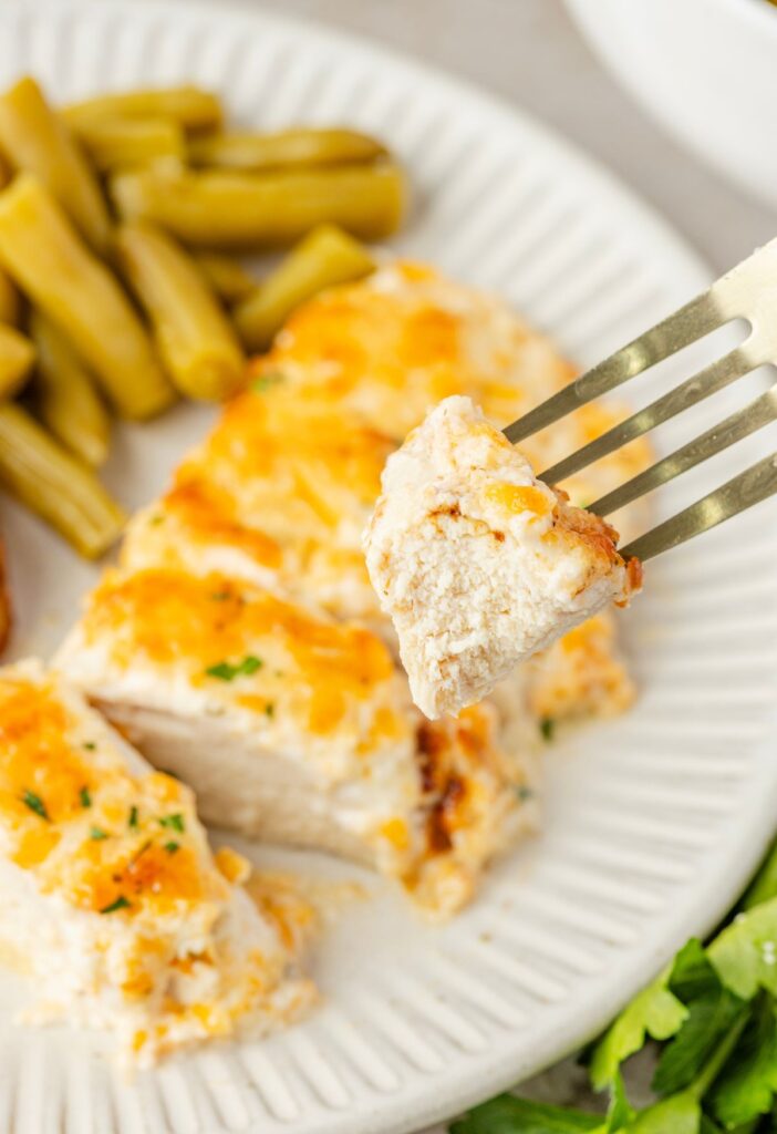 A piece of the chicken on the fork