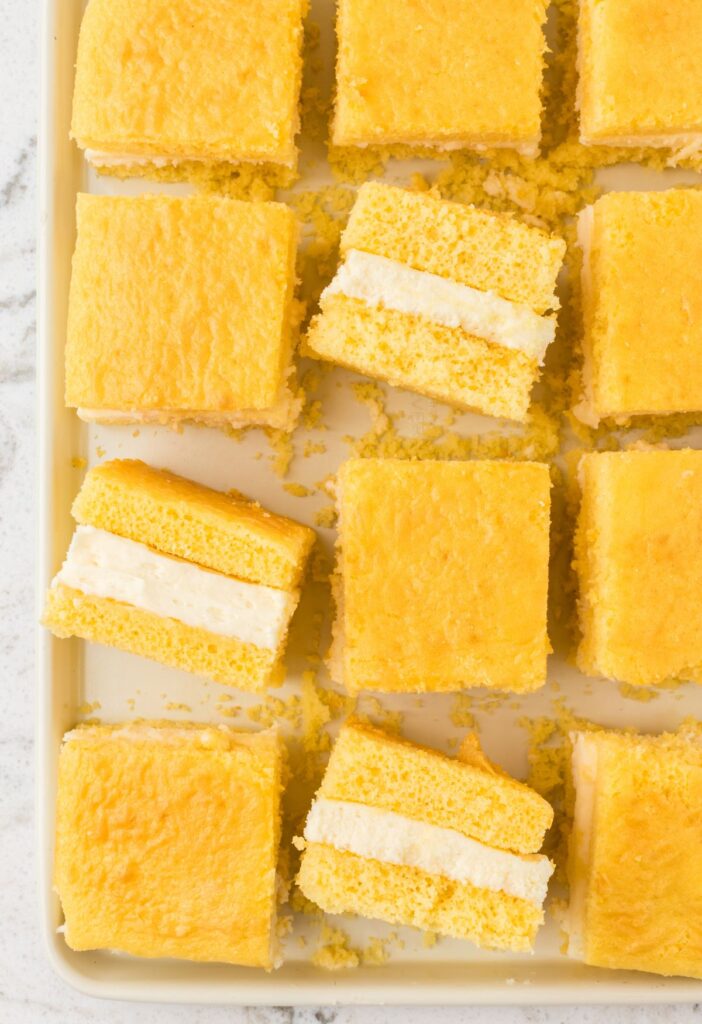 Cut slices of the Twinkie Cake with a yellow cake mix and marshmallow cream filling.