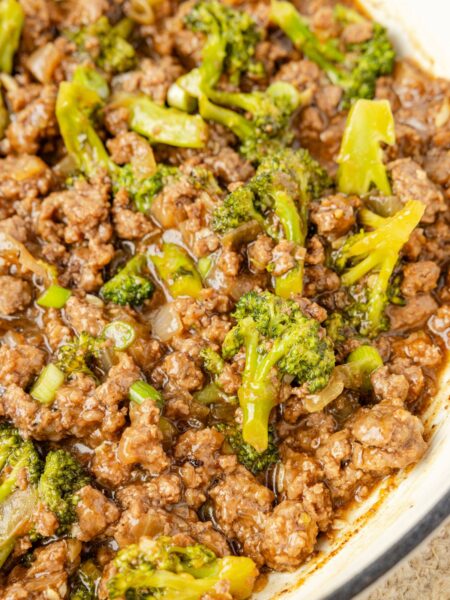 A skillet pan of ground beef with broccoli