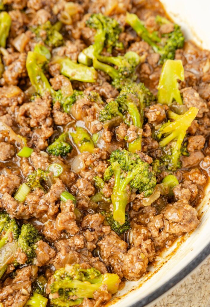 A skillet pan of ground beef with broccoli