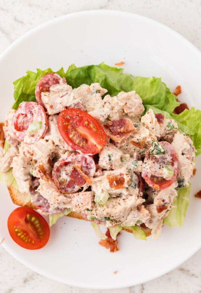 Top view of the chicken salad on a green lettuce leaf