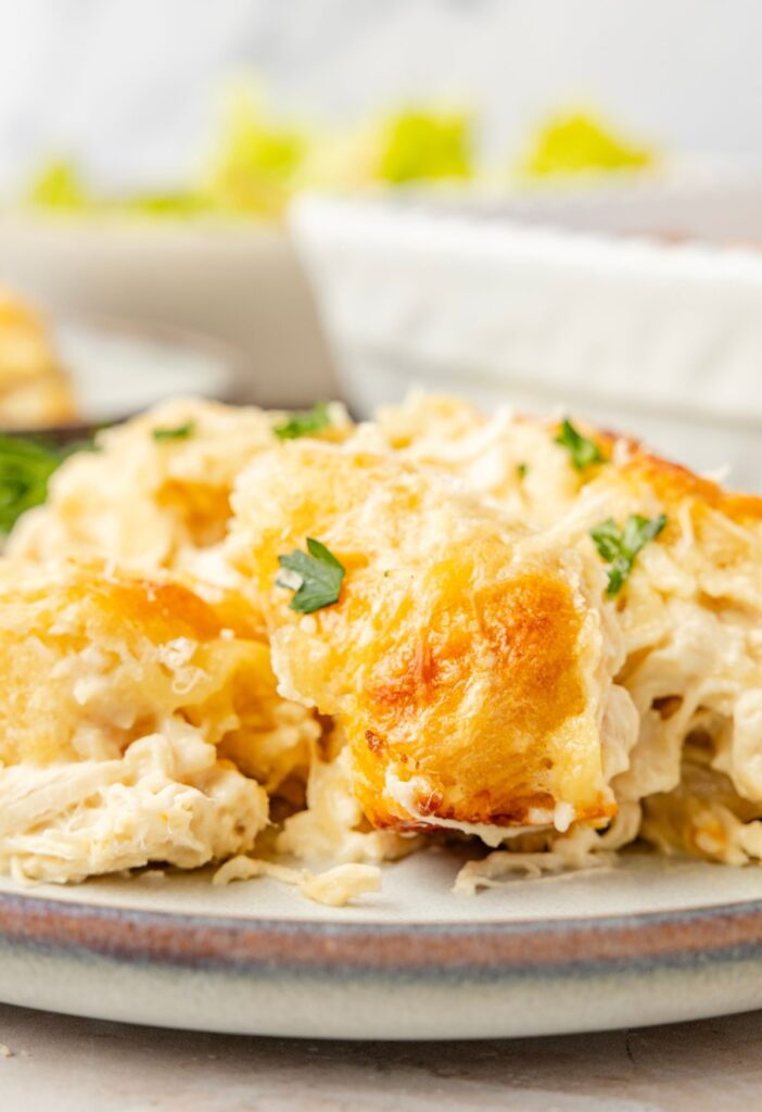 A plate of a serving of the biscuit casserole with chicken Alfredo