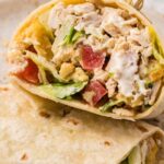A chicken salad wrap with a toothpick in it