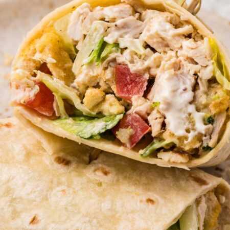 A chicken salad wrap with a toothpick in it