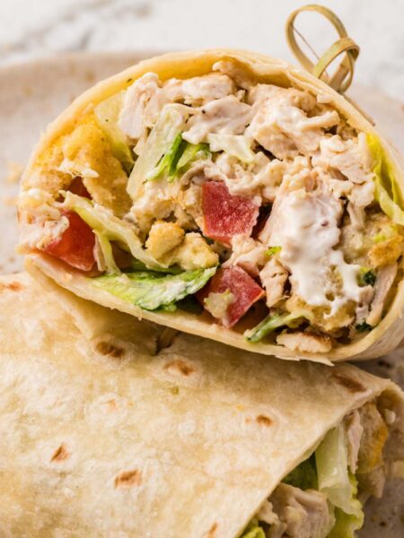 A chicken salad wrap with a toothpick in it