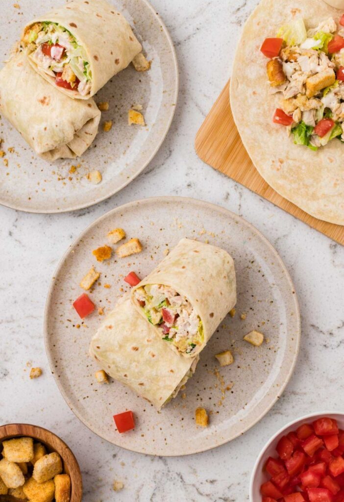 A top view of the chicken wraps on a plate