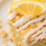 A piece of lemon coffee cake with a lemon glaze