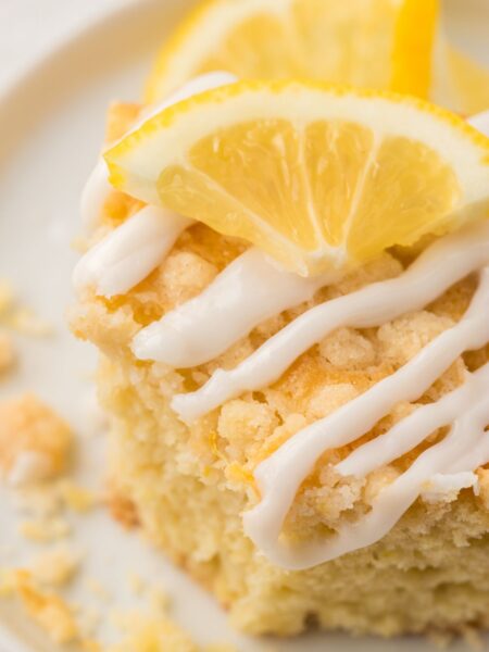 A piece of lemon coffee cake with a lemon glaze