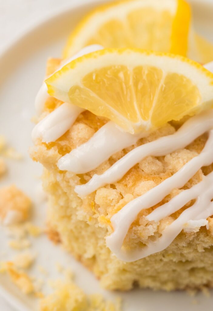 A piece of lemon coffee cake with a lemon glaze