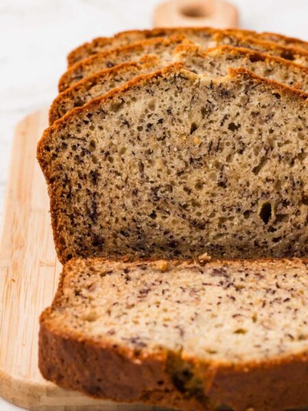 A loaf of banana bread that has been cut into slices.