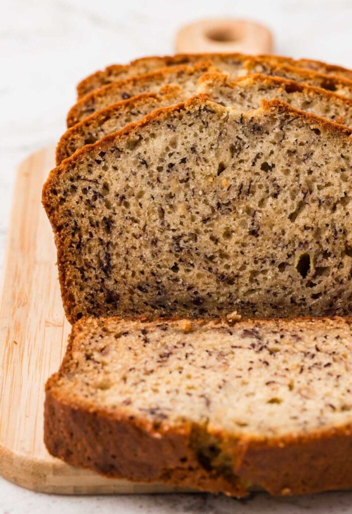 A loaf of banana bread that has been cut into slices.