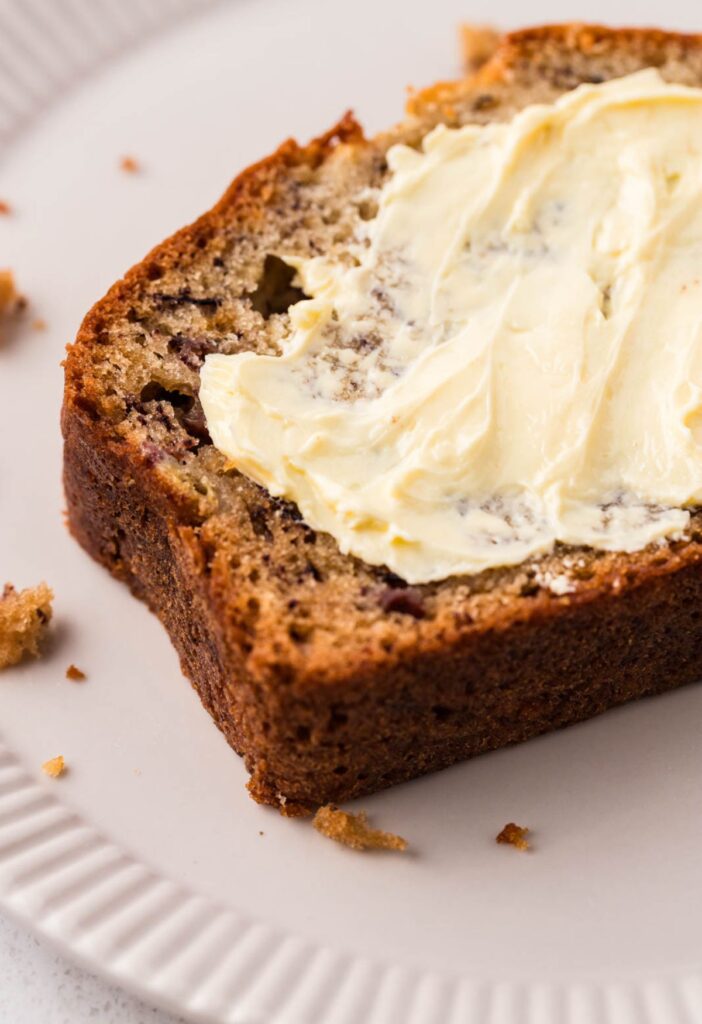 slice of banana bread with butter on it
