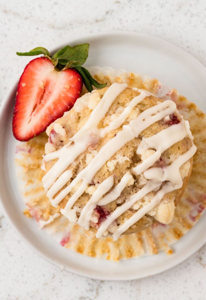 Top view of a strawberry muffin with a glaze.