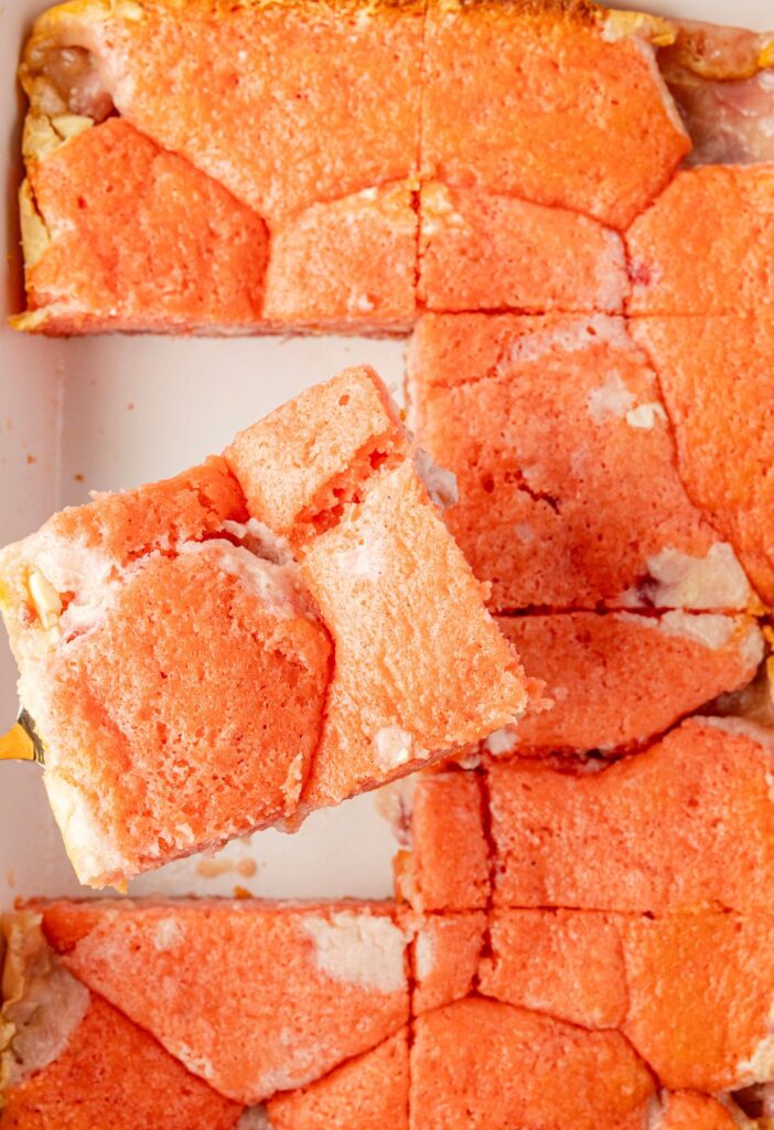 A slice of cake being served on a spatula.