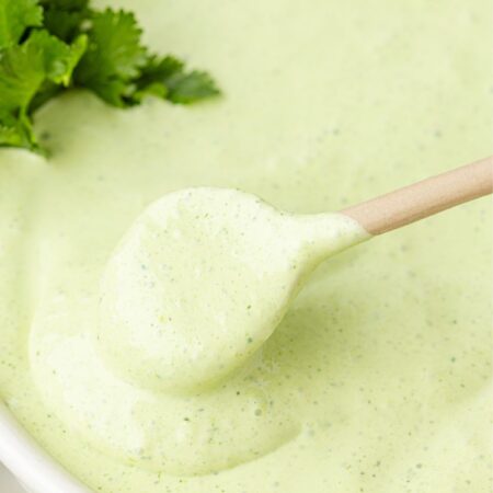 A white bowl of the cilantro lime sauce
