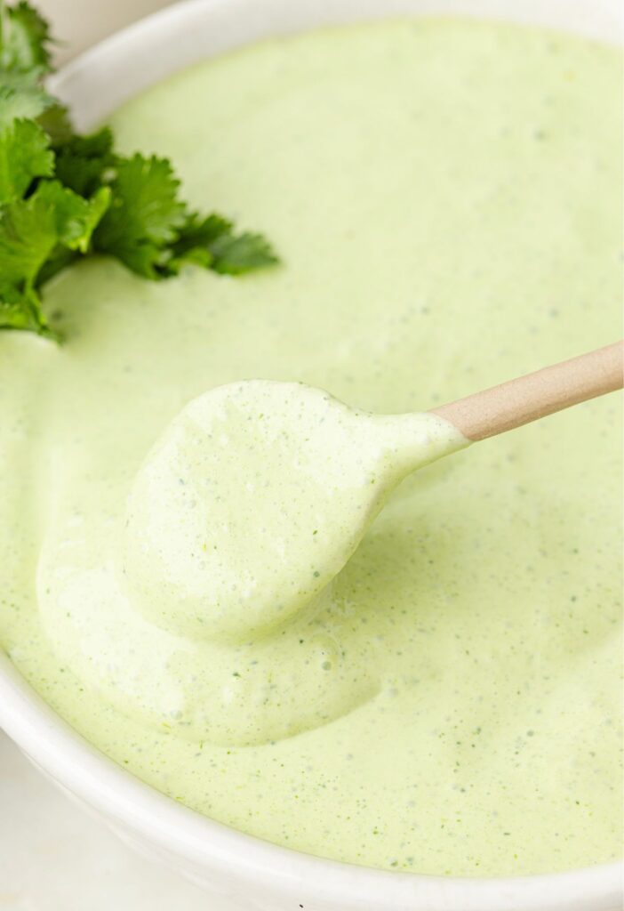A white bowl of the cilantro lime sauce