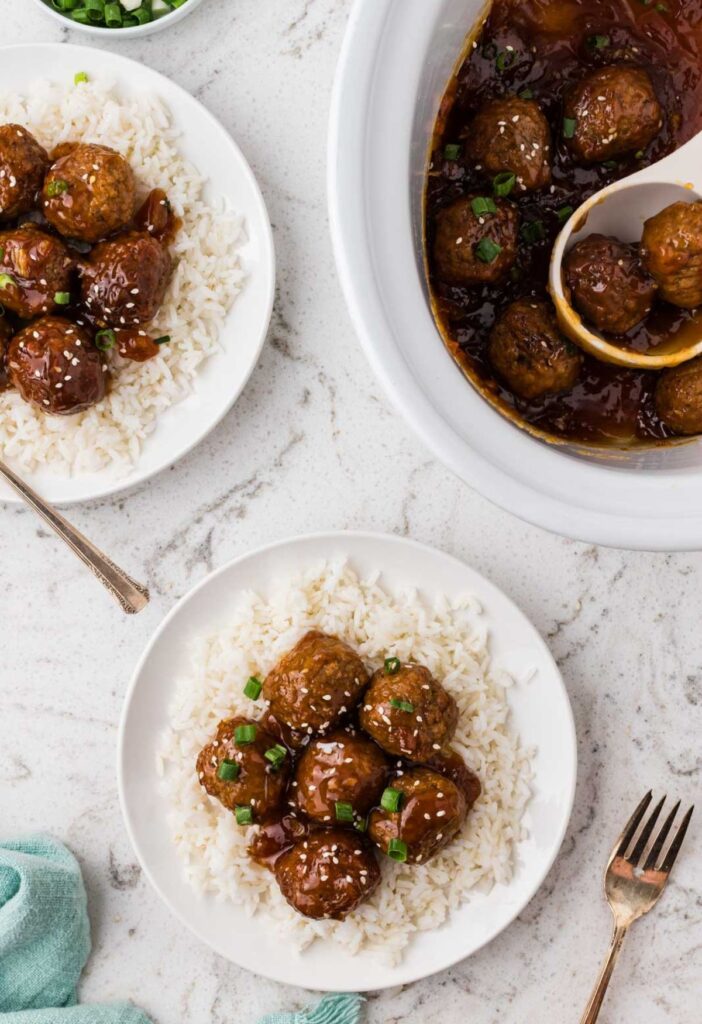 Top view of the crockpot of meatballs and a serving of them