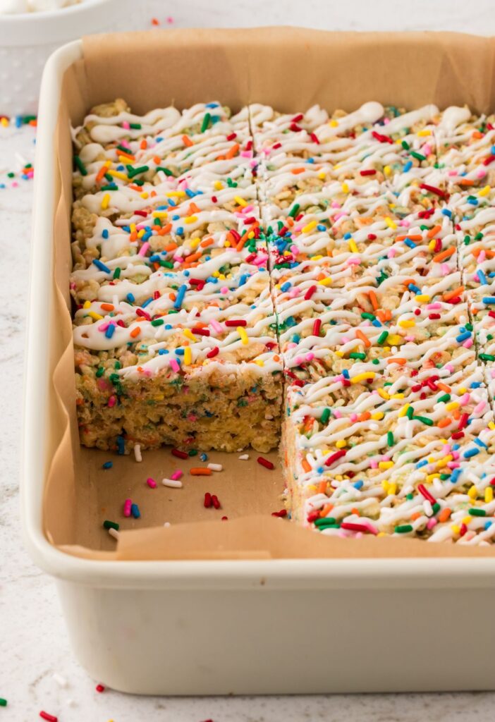 Side view of the pan of Rice Krispie treats with one taken out