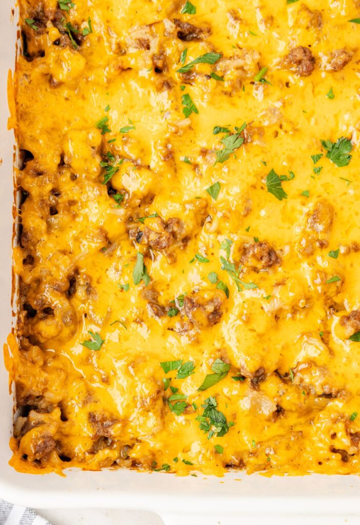 A casserole dish with the cheesy baked casserole in it