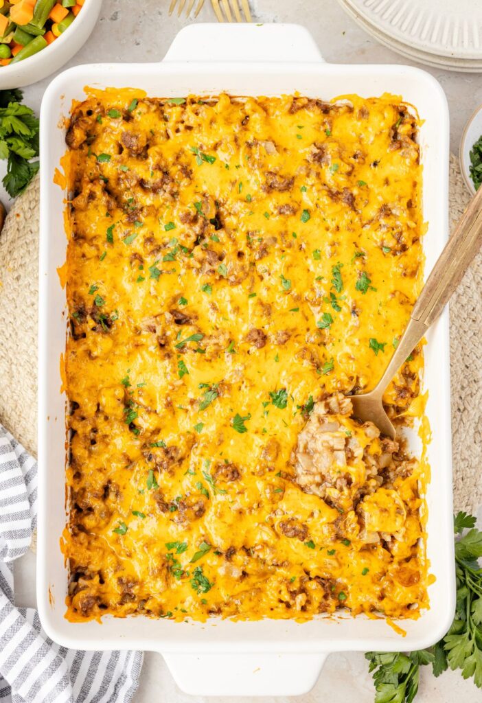 Top view of the cheesy oven baked casserole with hamburger meat and rice.