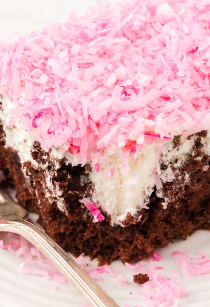 Piece of the poke cake with a fork
