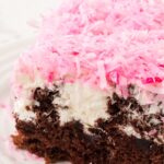 A slice of the poke cake on a white plate