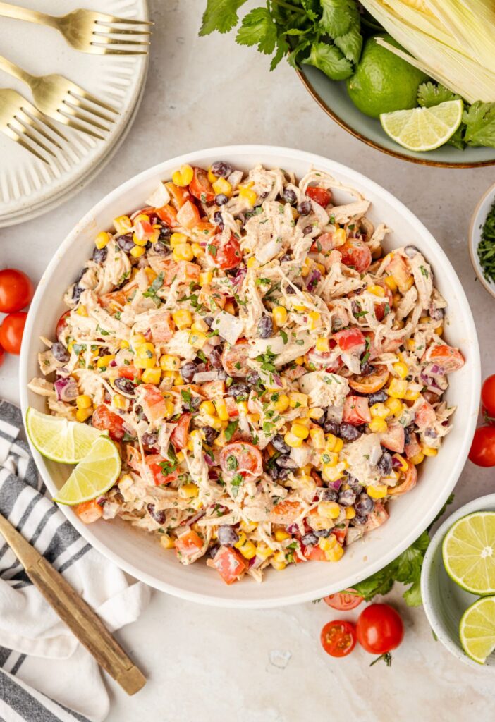 Top view of the bowl of chicken salad with the ingredients around it.