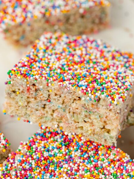 Close up of the sprinkles on top of the dot cake cake batter Rice Krispie treats