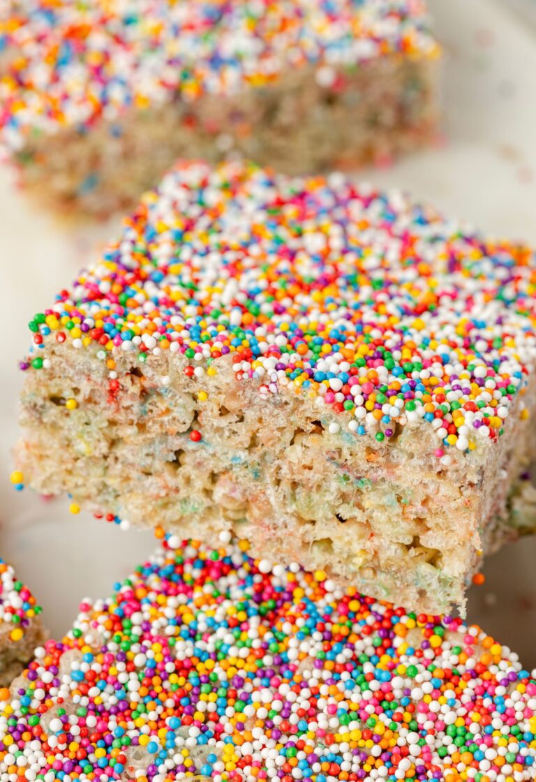 Close up of the sprinkles on top of the dot cake cake batter Rice Krispie treats