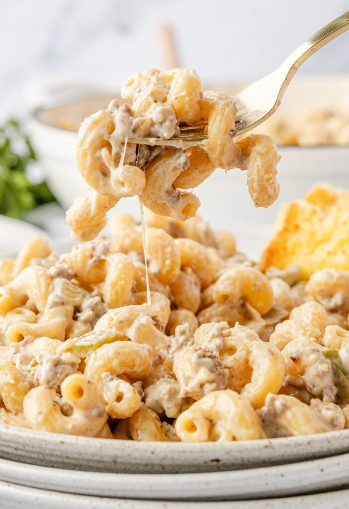 A fork with some pasta on it