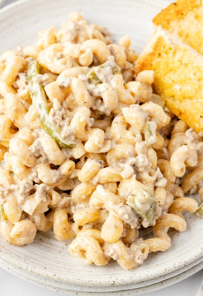 A serving of the cheesesteak pasta with garlic bread