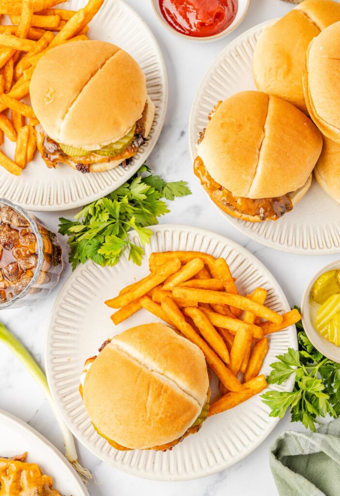 Overhead pic of the burgers with fries and ketchup