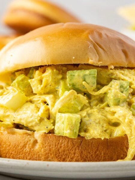 Close up of the sandwich with curry chicken salad in it