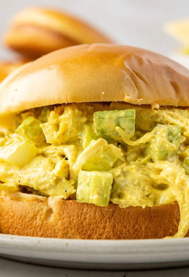 Close up of the sandwich with curry chicken salad in it