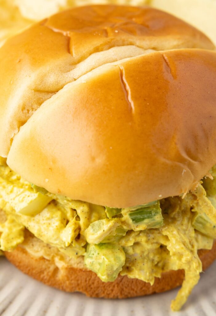 A sandwich, close up picture of the chicken salad.