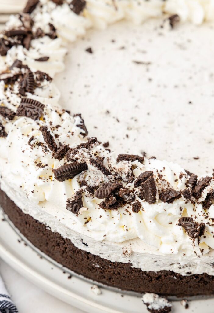 View of the Oreo cookie crust with the no bake Oreo cheesecake filling inside.