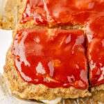 Close up of the baked sheet pan meatloaf cut into squares