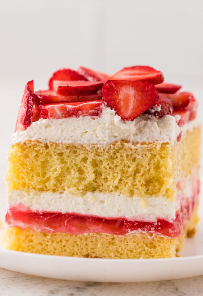A front view of a slice of strawberry shortcake