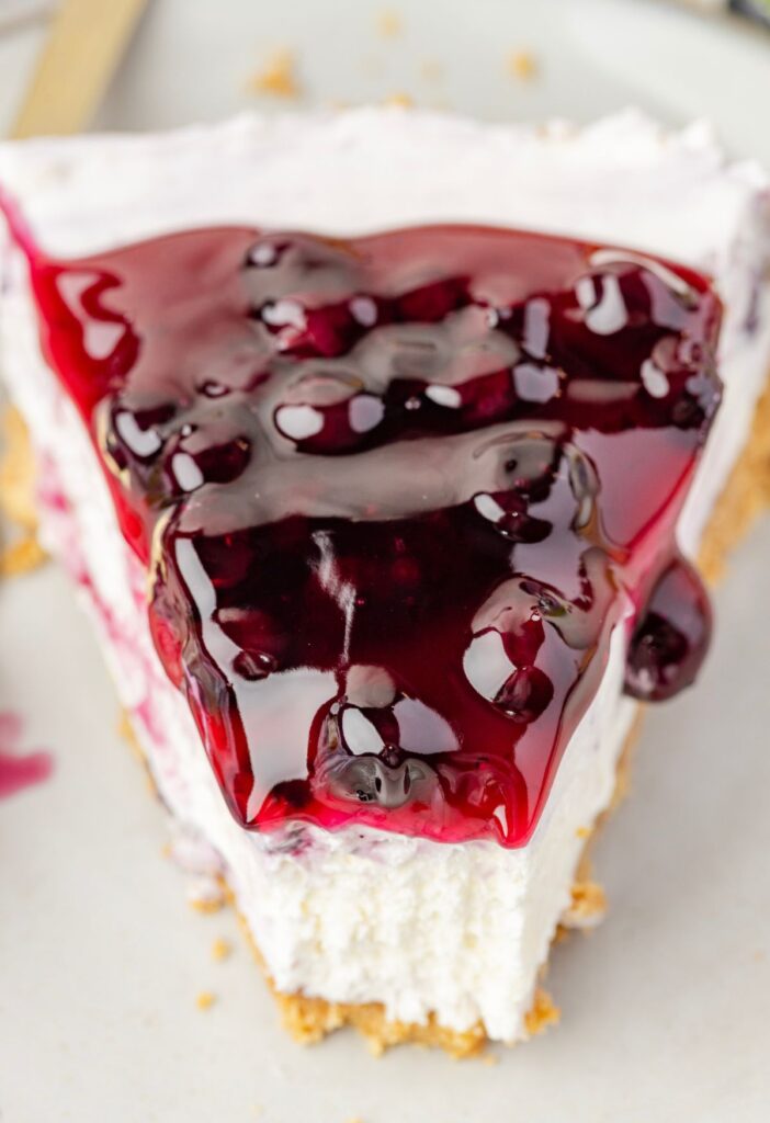 A slice of cheesecake with blueberry topping