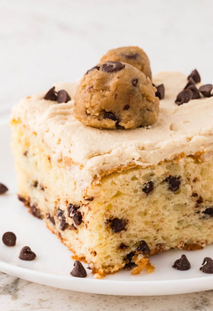 Slice of the cookie dough cake with a chocolate chip cake