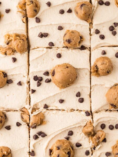 Top close up view of the edible cookie dough frosting on top of the chocolate chip cake.