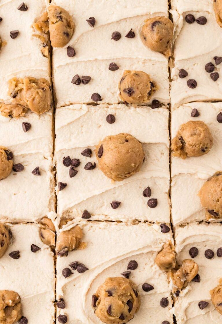 Top close up view of the edible cookie dough frosting on top of the chocolate chip cake.