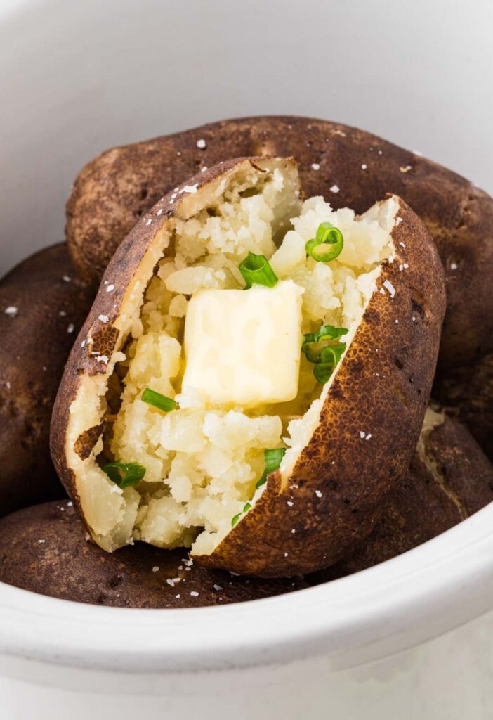 A baked potato inside the slow cooker
