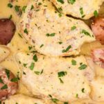 Inside the slow cooker with the cooked pork and potatoes.