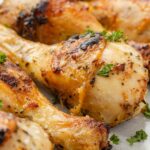 Oven baked chicken drumsticks ready to serve for dinner.