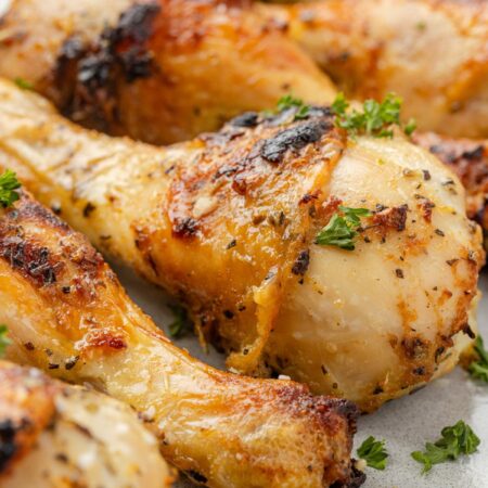 Oven baked chicken drumsticks ready to serve for dinner.